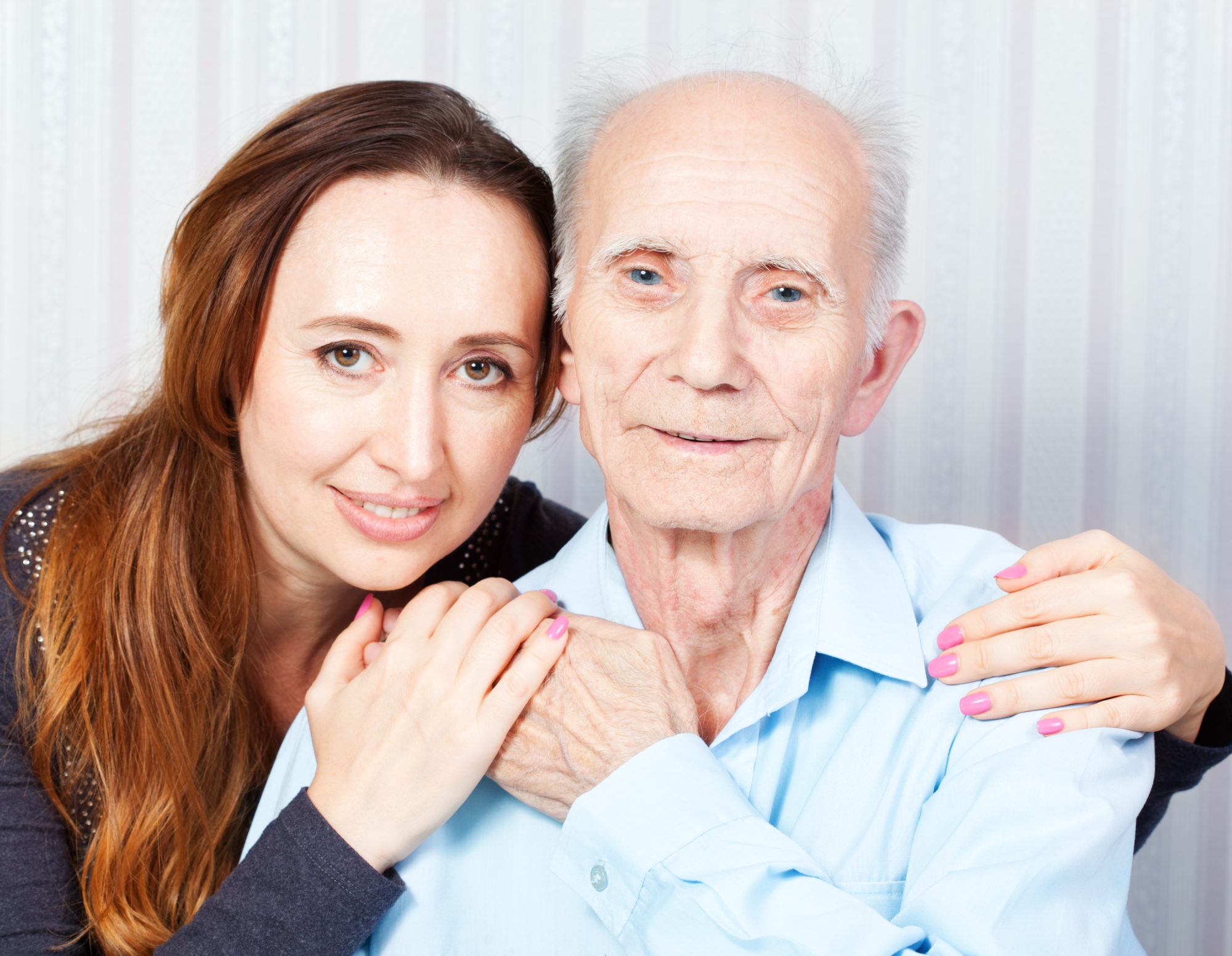 Senior man with her caregiver at home