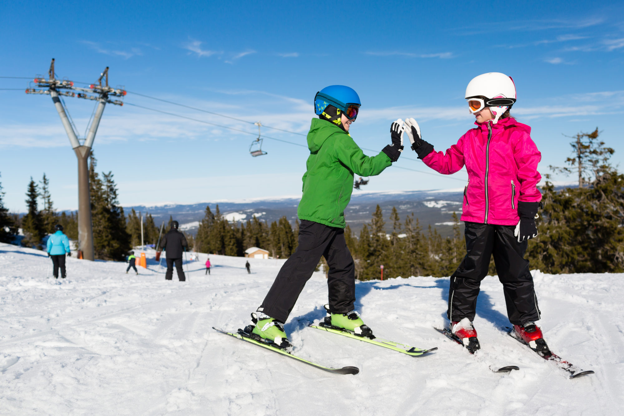 Two happy kids at ski piste
